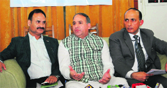 Minister of State for Health Shabir Ahmad Khan and Director Health Services, Kashmir, Saleem-ur-Rehman address a press conference in Srinagar on Monday. Tribune photo: Amin War