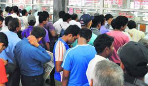Passengers line up at the railway ticket counters in Ludhiana. 