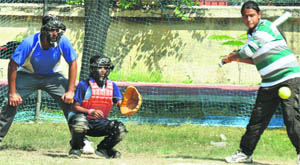 Girls in action during a match in the Sub-Junior Punjab State Softball Championship at Guru Nanak Stadium in Ludhiana on Monday. 