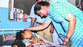 Preneet Kaur, Union Minister of State for External Affairs, meets Manpreet Kaur, a robbery victim, at Rajindra Hospital in Patiala on Monday.