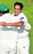 Pakistans Zulfiqar Babar celebrates with his teammates. 