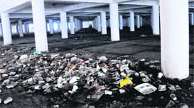 Garbage lies scattered at an underground parking lot near the MOH building in Sector 17.