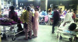 Dengue patients undergo treatment in a corridor near the Emergency ward at the GMCH, Sector 32, Chandigarh.