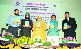 Governor Aziz Qureshi releases a book written by Additional District Magistrate Harak Singh Rawat in Dehradun on Tuesday