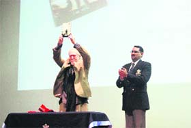 Actor Tom Alter releases a book at a function held at Rashtriya Indian Military College in Dehradun on Monday evening