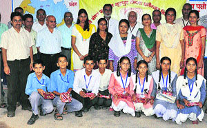 Members of the Gayatri Seva Samiti with school students. 