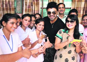 Silver screen: Bollywood actors Minisha Lamba and Aryan Babbar give autographs to fans during the promotion of their upcoming Punjabi film Heer and Hero at St Soldier School in Jalandhar on Tuesday