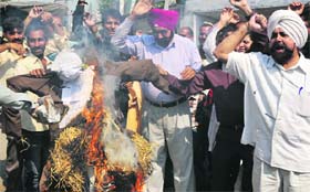 Members of the Evacuee Property Tenants Welfare Society protest against the atrocities by the Custodian Department in Jammu on Tuesday.