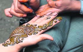 A woman gets henna applied in Srinagar on Tuesday.