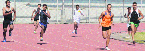 Athletes participate in a race during the Open Ludhiana District Athletics Meet on Tuesday. Photo: Inderjeet Verma