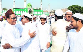People greet each other after offering prayers on the occasion of Eid-ul-Azha, at the Eidgah in Bathinda on Wednesday.