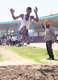 A contestant takes part in long jump on the first day of the district-level athletics meet at the Multipurpose Sports Stadium in Bathinda on Wednesday.
