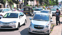 Vehicles parked on the road leading to chaos in front of the Deputy Commissioners office at Phase I