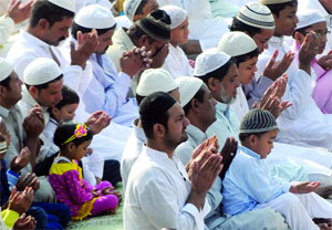 Devotees offer prayers on the occasion of Eid-ul-Zuha at Feroz Shah Kotla Mosque in New Delhi on Wednesday. 