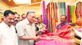 Chief Minister Vijay Bahuguna visits a stall after inaugurating Silk Mark Expo-2013 in Dehradun on Wednesday.