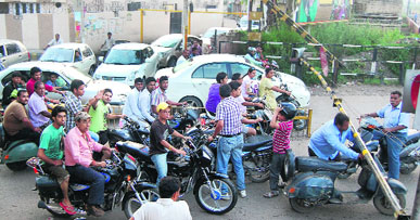 Commuters wait for a train to pass and gates to open at the busy Sodal rail crossing, where a railway underbridge is proposed to be constructed, in Jalandhar.