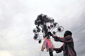 A toy sellers wares brighten up the cloudy sky in Jammu