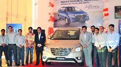 Officials during the launch of a new model of Innova in Jammu on Tuesday. A Tribune Photograph
