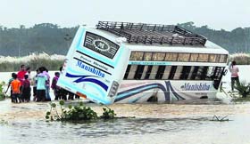 A private bus stuck in flood water in Kendrapada district of Odisha on Wednesday.
