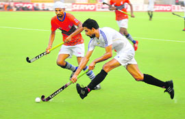 A match in progress between Punjab & Sind Bank and Bharat Petroleum during the Surjit Singh Hockey Tournament in Jalandhar on Wednesday.
