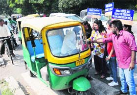 Students of Sri Guru Gobind Singh College, Sector 26, create awareness on traffic rules in Chandigarh on Thursday