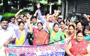 Residents of Clemen Town hold a demonstration against the monkey menace in their area in Dehradun on Thursday.