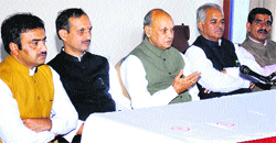 Former Chief Minister PK Dhumal, BJP state president Satpal Satti and others at a press conference in Barog on Thursday.