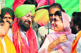 Partap Singh Bajwa, PPCC chief, and Congress MLA Rajinder Kaur Bhattal at Valmiki Jayanti Shobha Yatra in Jalandhar on Thursday.