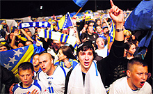 Supporters of Bosnia and Herzegovinas national football team celebrate after the team qualified for the 2014 World Cup, their first major tournament as an independent nation, with a 1-0 win over Lithuania in their final qualifier