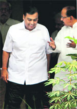 Union Minister for Petroleum and Natural Gas M Veerappa Moily with Reliance Industries' chairman Mukesh Ambani after a meeting at his residence in 