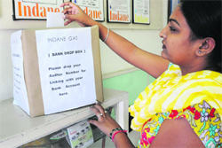 A woman submits her Aadhaar number at the office of a gas agency in Chandigarh. Tribune Photo: manoj Mahajan 