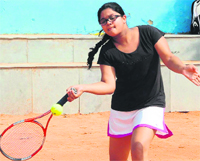 Manvi of Sacred Heart School returns a shot during a match of the CBSE North Zone Tennis Tournament at Mount Carmel School, Sector 47, in Chandigarh on Friday. Tribune photo