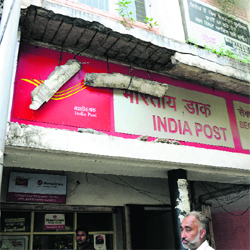 Broken concrete blocks hang dangerously outside the Sector 21 post office in Chandigarh. Tribune photo: Manoj Mahajan