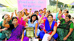 Anganwari workers hold a demonstration in support of their demands in Dehradun on Friday