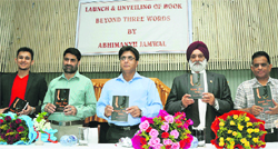 Chief Vigilance Commissioner (centre) Kuldeep Khoda along with University of Jammu Vice-Chancellor Mohan Paul Singh Ishar (second from right), ICCR regional director Balwant Thakur (second from left) and author Abhimanyu Jamwal (extreme left) release the Book Beyond Three Words in Jammu on Friday. Tribune Photo: Inderjeet Singh