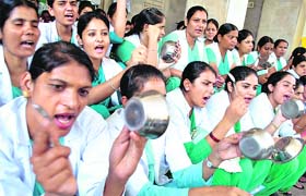 On protest path: Members of the Contractual Nursing Association protest seeking regularisation of their services at Government Rajindra Hospital in Patiala on Friday