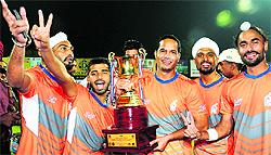 Winners Punjab and Sind Bank strike a pose with the trophy