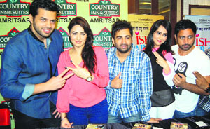 Off screen: The star cast of the Punjabi film 'Ishq Garaari' during a press conference in Amritsar on Saturday.
