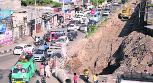 A dug up road at the exhibition ground in Jammu on Saturday. 