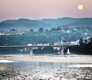 A view of the rising moon behind the hills in Jammu on Saturday.