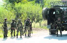 Army soldiers cordon off the area and launch searches to trace the attackers in Handwara area of Kupwara district on Saturday.