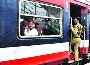 A Railway Protection Force jawan guards a train at the Anantnag railway station on Saturday.