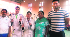Manjot Kaur Gill and Bhavleen Kaur flanked by coaches Rakesh Singh (left) and Amandeep. A Tribune photograph