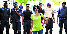 A supporter of presidential candidate Mohamed Nasheed holds up a placard during a protest in Male on Saturday