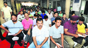 Bidders at an auction at the RLA office in Sector 17 on Sunday.