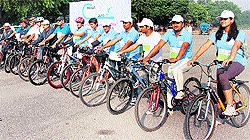 Residents take part in a cycle rally organised in Gurgaon on the occasion of World Osteoporosis Day on Sunday