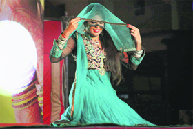 A woman performs during a Karwa Chauth function at Lodhi Club in Ludhiana on Sunday.