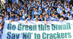Students of the GMSSS, 19-C, showcase a banner in Chandigarh on Monday.