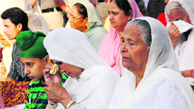 A relative of a martyr weeps during the parade