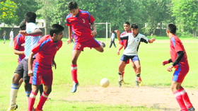 Players in action during the Inter-School Football Championship being held at the GMSSS, Sector 22, in Chandigarh on Monday.